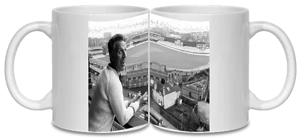 Bruce Forsyth Entertainer July 1965 looking over the balcony of his flat which