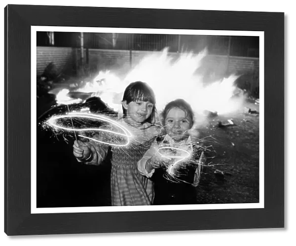 Clare aged 6 and Lindsay Gerard aged four (right) enjoying their sparklers at an
