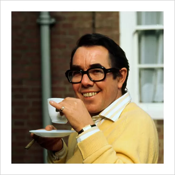 Ronnie Corbett holding teacup December 1977
