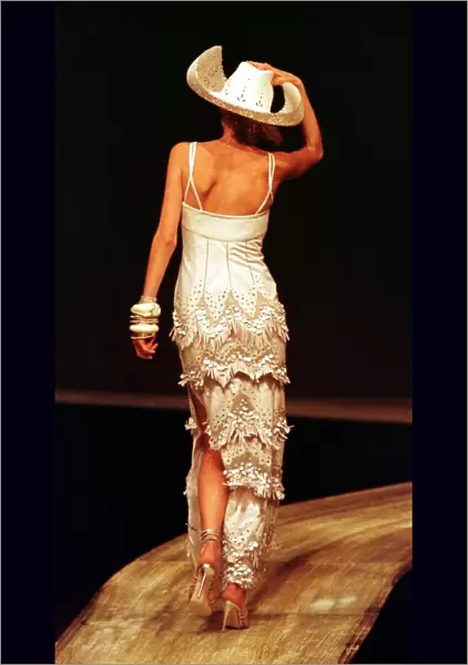 Stella Tennant sports a cream cowboy dress October 1997