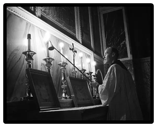 The Cardinal at Westminster Cathedral, lighting candles