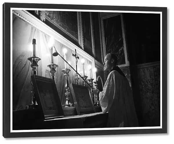 The Cardinal at Westminster Cathedral, lighting candles