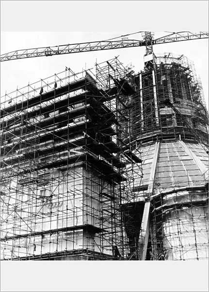 In a web of steel scaffolding, the main entrance to the Liverpool Metropolitan Cathedral