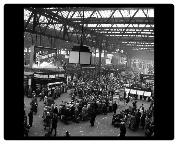 Holidaymakers leaving Waterloo Station, London. July 1954