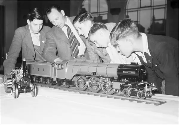 A group of Coventry school boys inspect a model of a LNER A1 steam locomotive circa