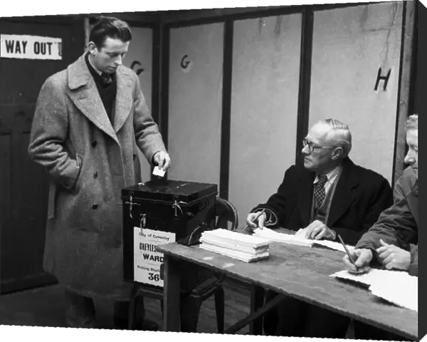 A Coventry voter casts his vote in the 1959 General Election at Cheylesmore polling
