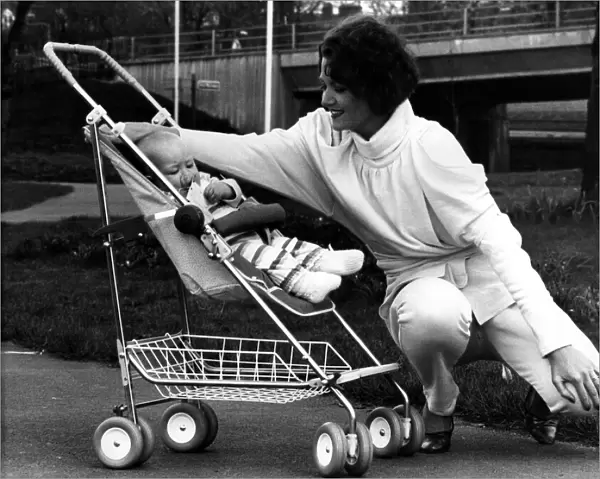 Rena pictured in a 1984-style jump suit and baby Thea relaxes in the new McLaren Dreamer