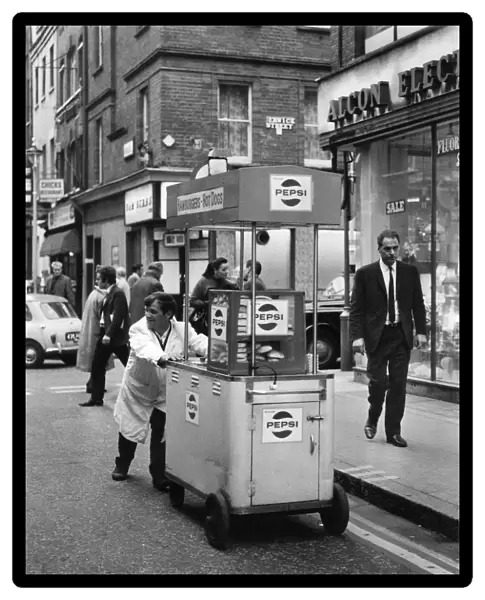 Hot Dogs, John O Brien of Londons West End, pushes his hot dog stand