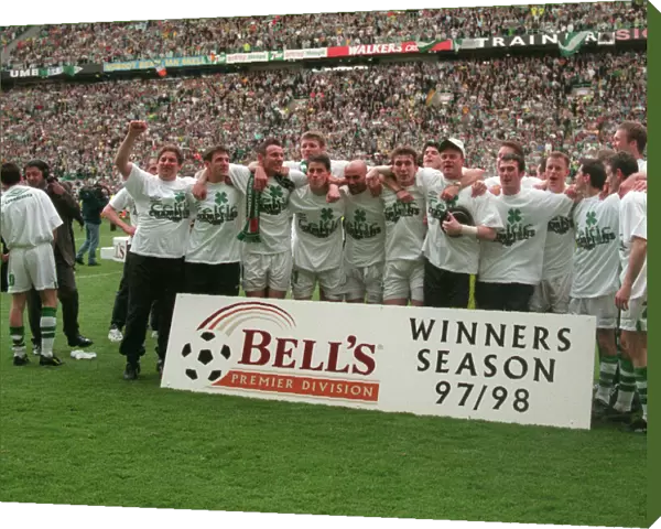 Celtic players celebrate winning the league championship 1998 with cup trophy winners