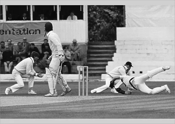 Over and Out. Yorkshire wicketkeeper Steven Rhodes dives to take a spectacular catch in