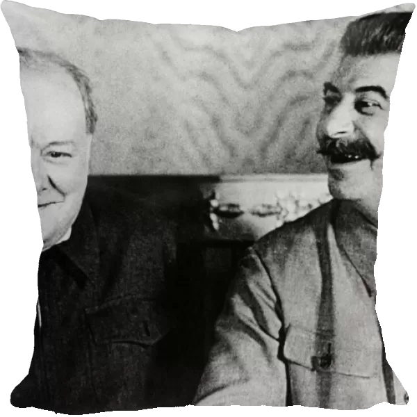 British Prime Minister Winston Churchill shares a joke with Soviet leader Josef Stalin