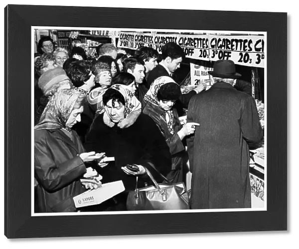 Customers crowding round a cigarette counter in the Co-op in London Road, Liverpool