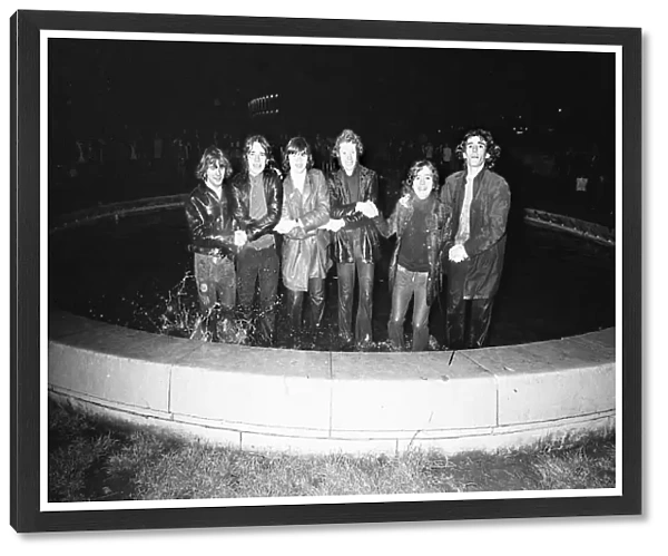 New Year Revellers seeing in 1973 by taking a quick dip in the fountain in Centenary