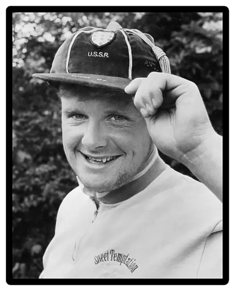 Paul Gascoigne proudly displays one of his under 21 caps as well as a touch of designer