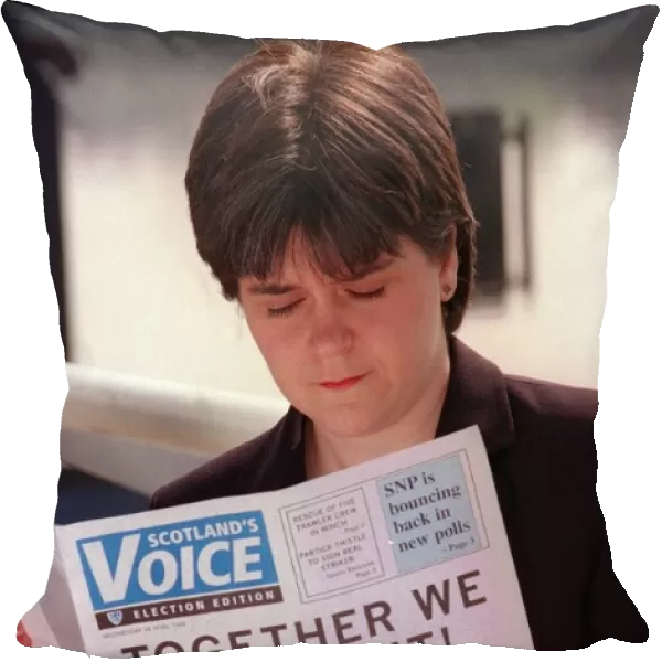 Nicola Sturgeon April 1999 reading a copy of Scotlands Voice newspaper