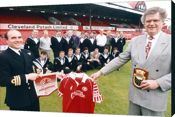 Middlesbroughs chairman, Colin Henderson, presents a set of shirts