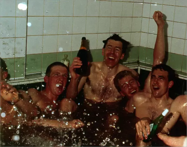 Celtic players celebrate in team-bath April 1988