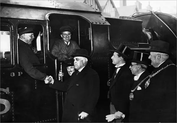 Sir Frederick Stamp, Chairman of the LM+S Railway shakes hands with Mr Fred Davis
