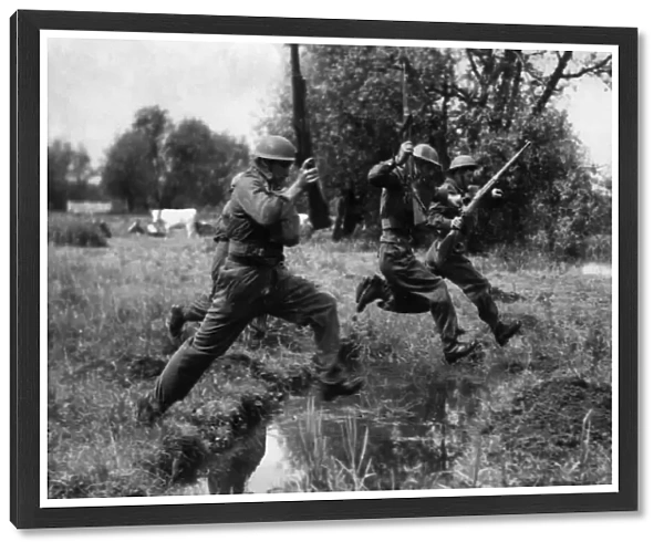 Members of the Reading Home Guard jumping ditches on the blitz course