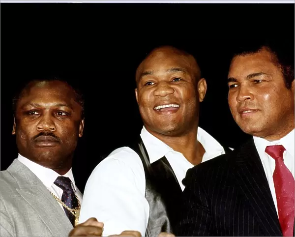 Joe Frazier Boxer former heavyweight champion pictured with George Foreman in middle