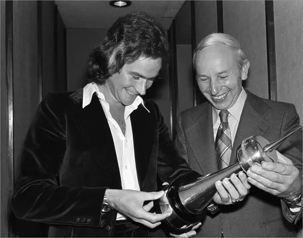 Britains World Motorcycle racing Champion Barry Sheene receives his awards for