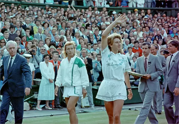 Steffi Graf pictured with a winning wave to the crowd as she walks off after the match