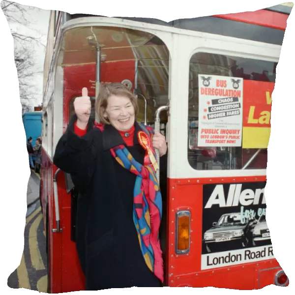 Actress Glenda Jackson standing at the back of a double decker bus