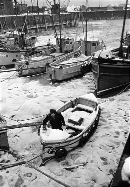 Fishing boats frozen in Whitstable Harbour, Kent. 20th January 1966