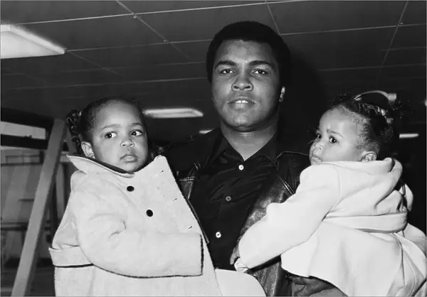 Muhammad Ali pictured here with his daughters at Heathrow Airport
