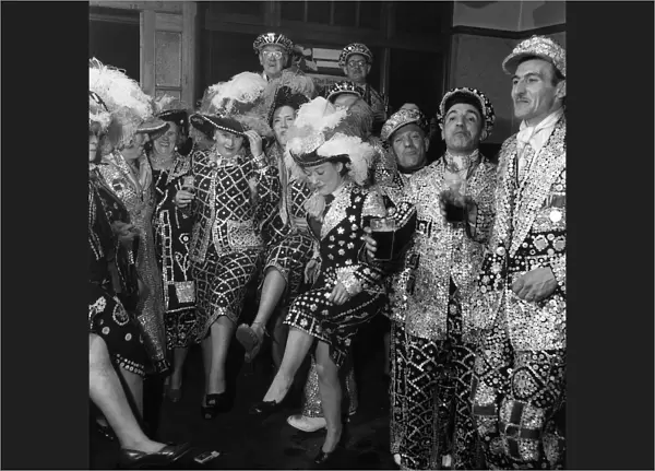 Pearly Kings and Queens celebrating in Hackney, East London. 24th March 1955