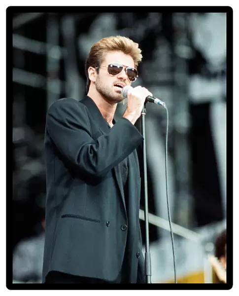 George Michael performing on stage at the Nelson Mandela 70th Birthday Tribute concert
