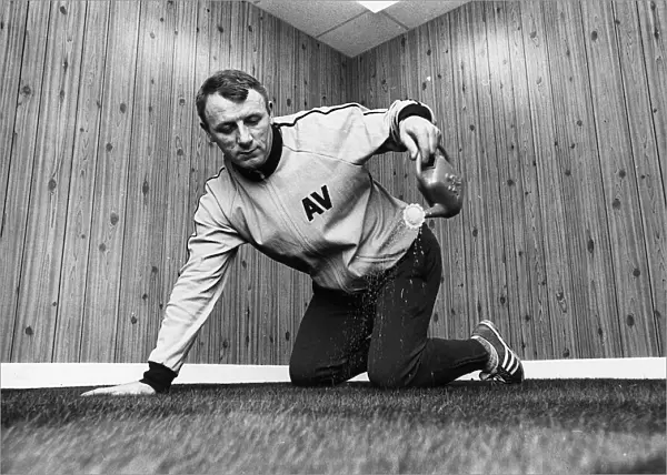 Tommy Docherty football manager Aston Villa FC watering carpet in his office watering can