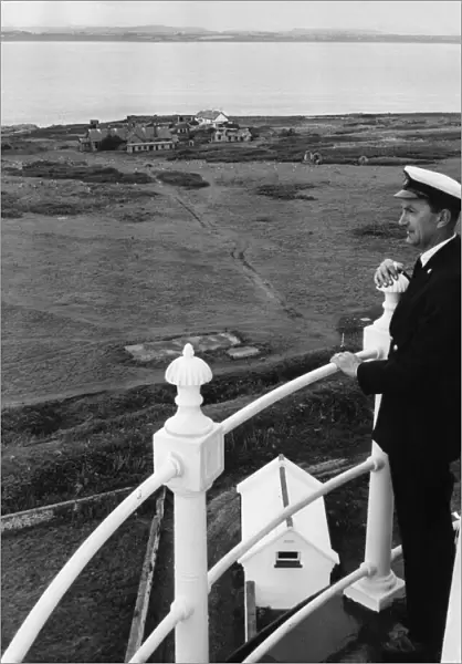 Principal Keeper Colin Nicholls admires the view from the top of the Flat Holm Lighthouse