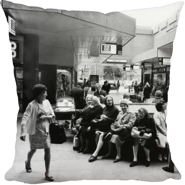 Shoppers sit, relax and chat at the Salford City Shopping Centre. June 1972