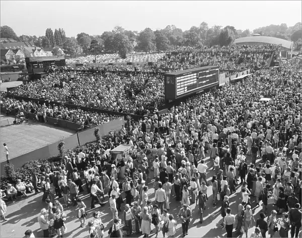 Wimbledon Tennis Championships. The huge crowd mill around the Tennis courts
