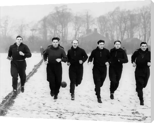 Liverpool footballers out at the clubs practice ground in West Derby training for