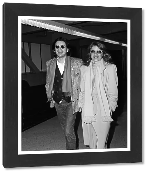 Charlotte Rampling and her husband Jean-Michel Jarre arriving at Heathrow Airport