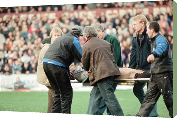 Gwyn Jones (number 7 ) is stretchered off the ground during the Cardiff verses Swansea