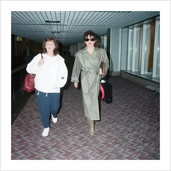 Actresses Joan Collins and Pauline Collins at Heathrow Airport. 8th April 1990