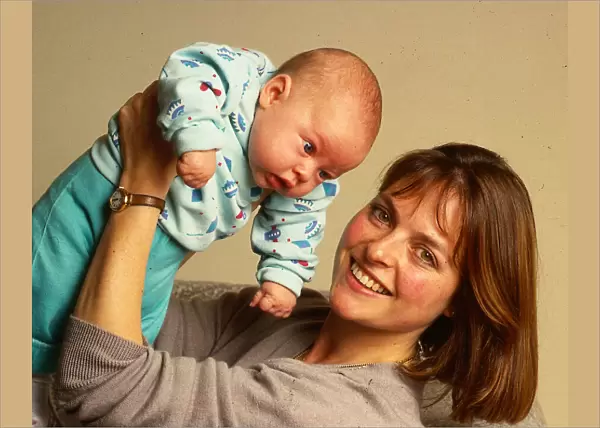 Janet Ellis TV television presenter November 1987 holding baby son Jack in the air