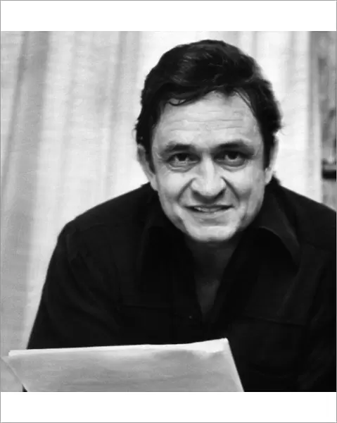 Johnny Cash, American singer-songwriter, guitarist, actor, and author