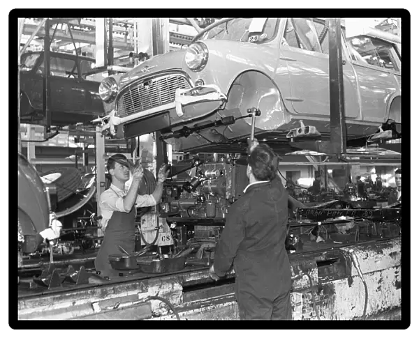 The front axel and engine seen here being mounted on to a Austin Mini on the production