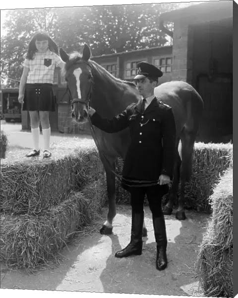 Sally Jones (9) from Bucks, pictured with the horse she named Warrior and PC Tom TucKer