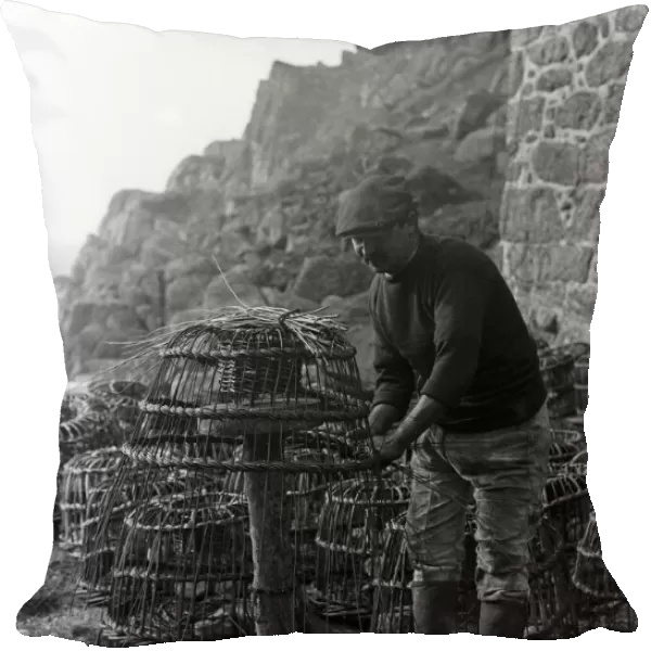 Crabpot making at Penberth, Shaping a crab pot. Cornwall. 1923