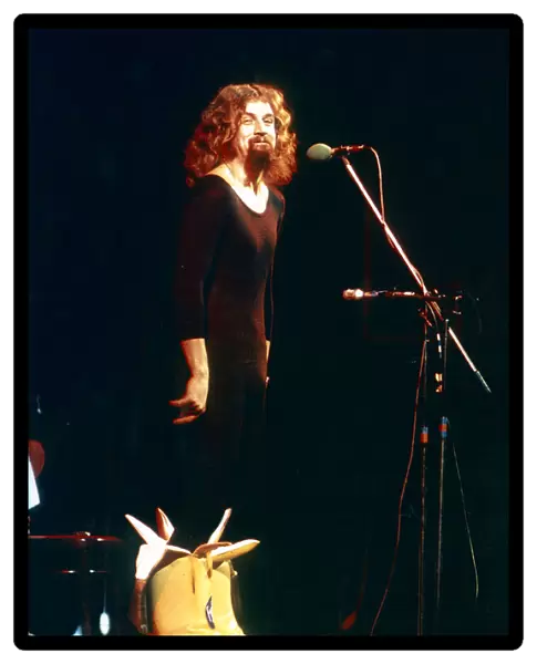 Billy Connolly on stage wearing big banana boots