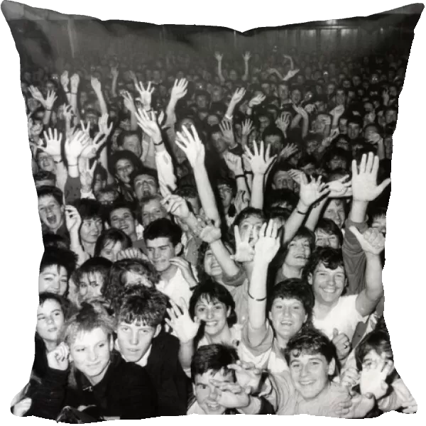 Crown of fans cheering on the Hull band Housemartins during a concert at the packed Hull