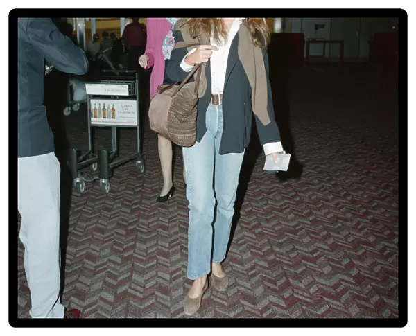 Cindy Crawford (model) at London Heathrow Airport. Cindy is with her husband, actor