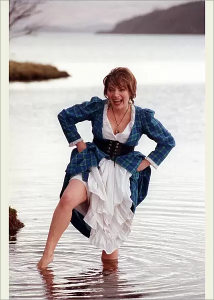 Lorraine Kelly GMTV presenter February 1998 wearing tartan dress wading in Loch