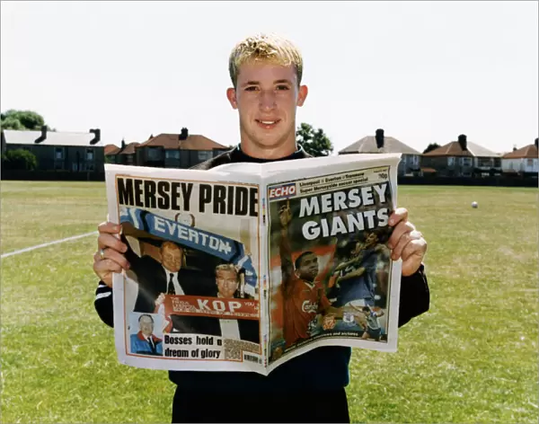 Liverpool striker Robbie Fowler with Mersey Giants Soccer Special. 10th August 1995