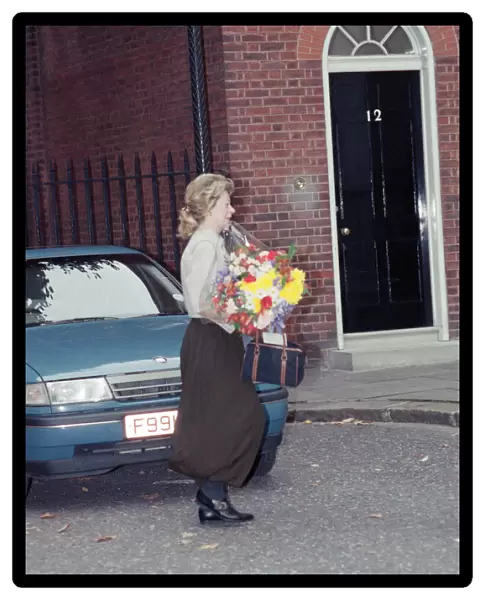 Therese Lawson with flowers. On the day Nigel and Therese Lawson move out of Downing